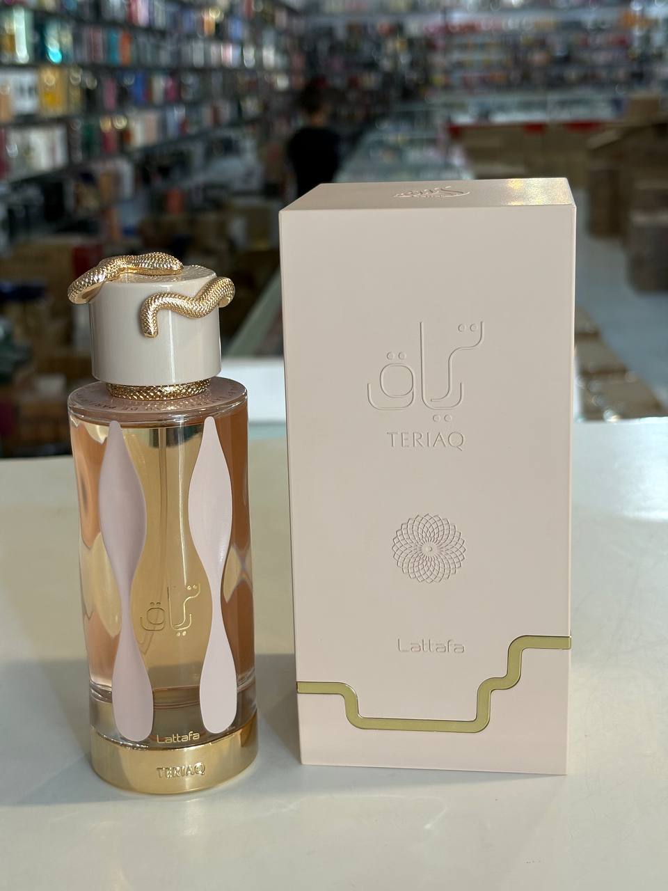 ادو پرفیوم لطافه تریاق TARYAQ یونیcex شیرین و گرم 100ml